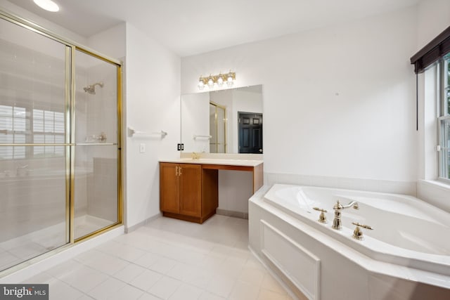 bathroom with independent shower and bath, vanity, and tile patterned floors