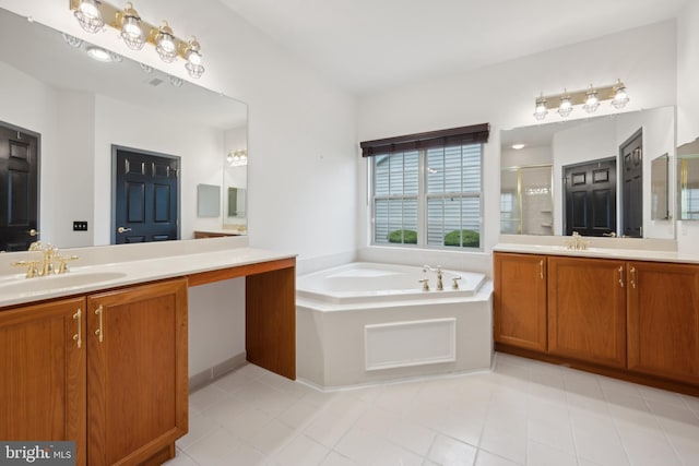 bathroom with vanity and separate shower and tub