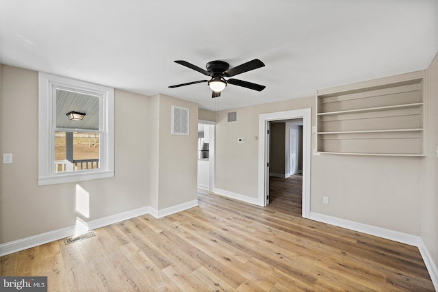 unfurnished room with light hardwood / wood-style floors and ceiling fan