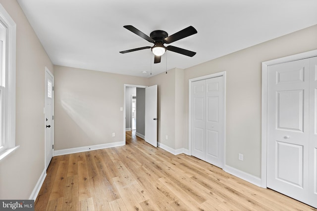 unfurnished bedroom featuring ceiling fan and light hardwood / wood-style flooring