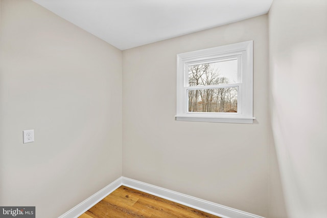 spare room featuring hardwood / wood-style floors