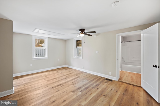 unfurnished room with ceiling fan and light wood-type flooring