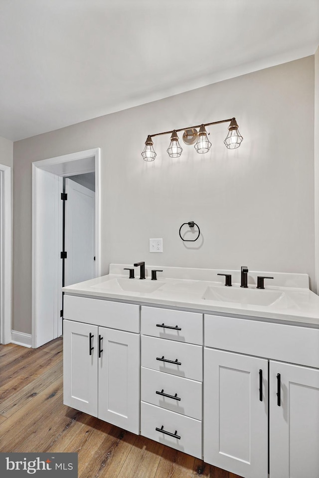 bathroom with wood-type flooring and vanity