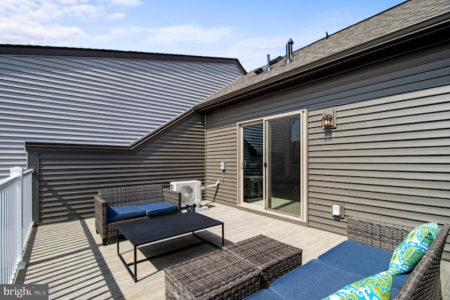 view of patio featuring a wooden deck, ac unit, and an outdoor hangout area