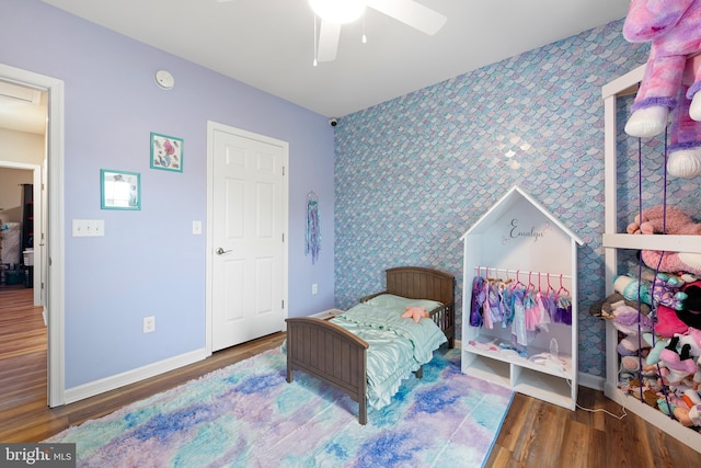 bedroom featuring wood-type flooring and ceiling fan