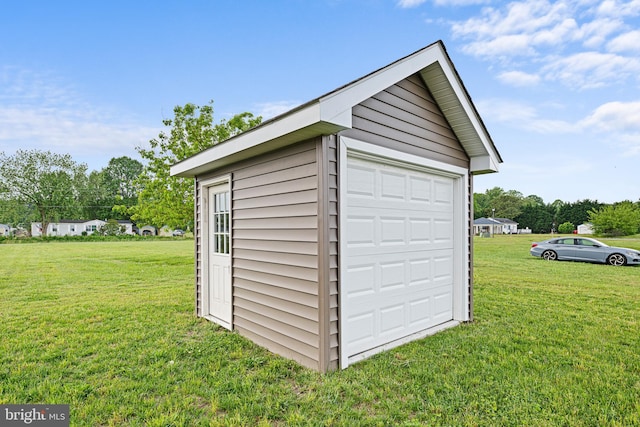 garage featuring a yard