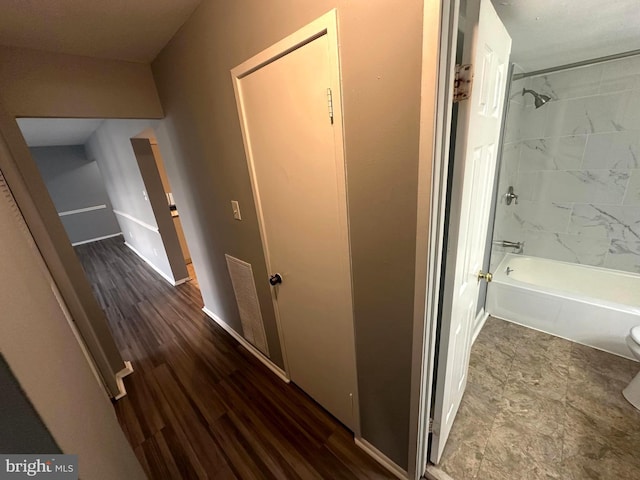 hallway featuring hardwood / wood-style floors