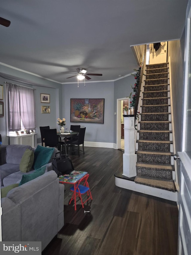 living room featuring ornamental molding, dark hardwood / wood-style floors, and ceiling fan