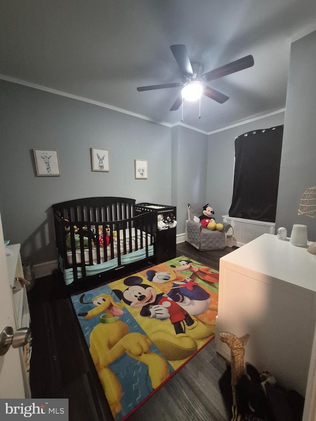 bedroom with ceiling fan, ornamental molding, and hardwood / wood-style floors