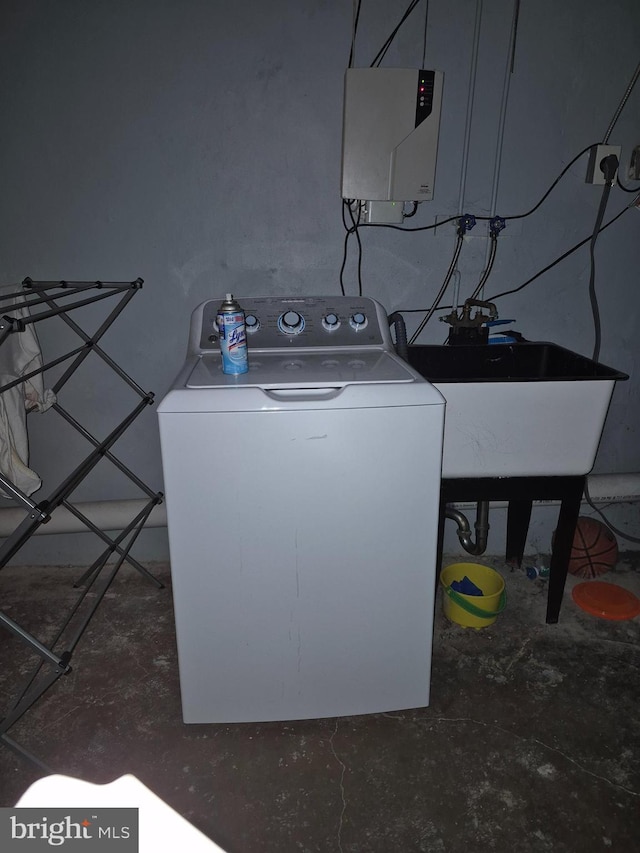 laundry room featuring washer / dryer and sink