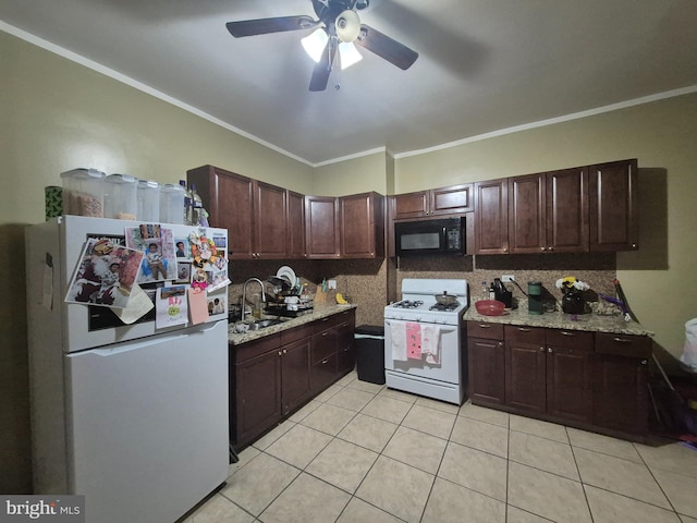 kitchen with crown molding, light tile patterned floors, white appliances, and decorative backsplash