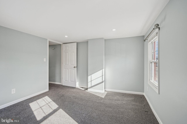 empty room featuring carpet flooring