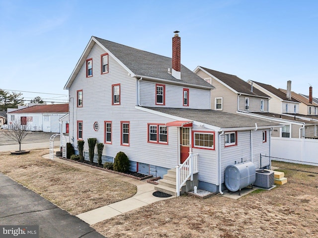 back of property with central AC unit