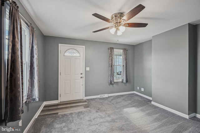 entrance foyer with ceiling fan