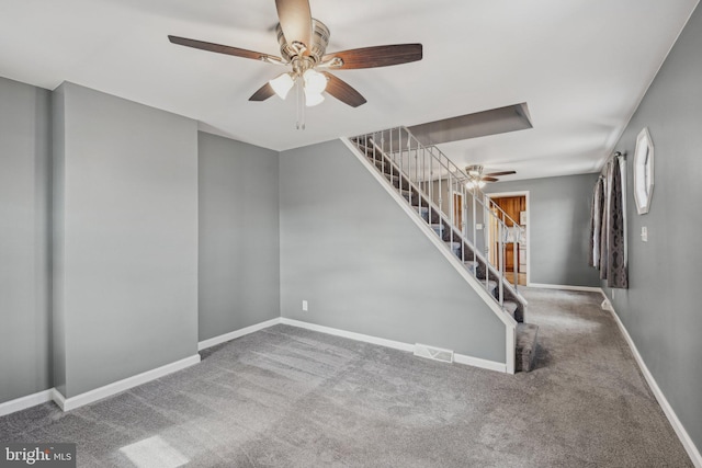 interior space with ceiling fan and carpet