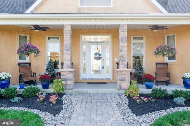 doorway to property with a porch and ceiling fan