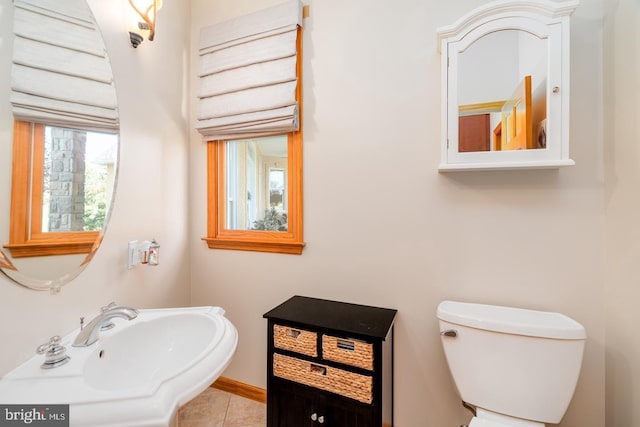 bathroom featuring tile patterned flooring, sink, and toilet