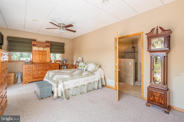 bedroom with ceiling fan and light carpet