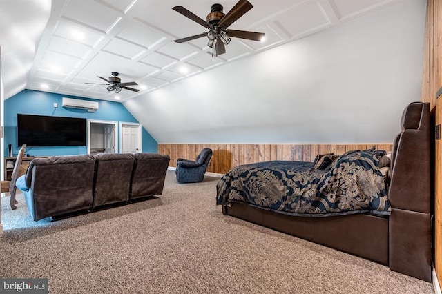 home theater room with vaulted ceiling, a wall mounted air conditioner, wood walls, carpet flooring, and coffered ceiling