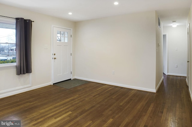 entryway with dark wood-style floors, visible vents, baseboards, and recessed lighting