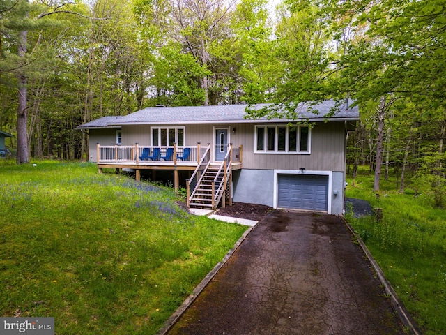 view of front of home featuring a garage and a deck