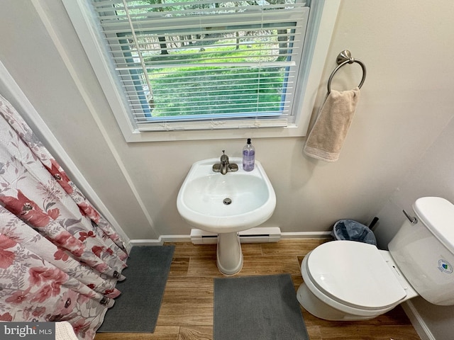 bathroom featuring toilet and hardwood / wood-style floors