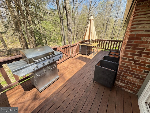 wooden deck featuring grilling area