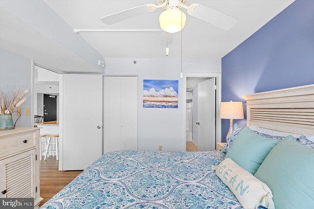 bedroom featuring ceiling fan, hardwood / wood-style floors, and a closet