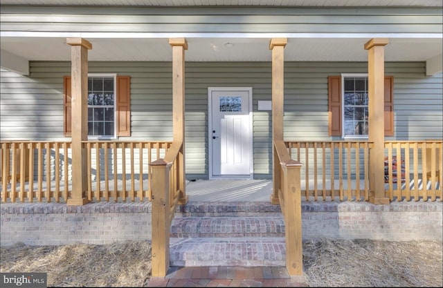 doorway to property with a porch