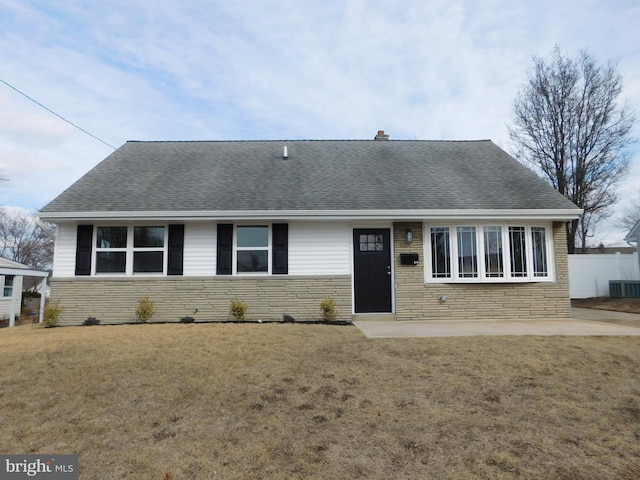 single story home with a patio, a front yard, and cooling unit