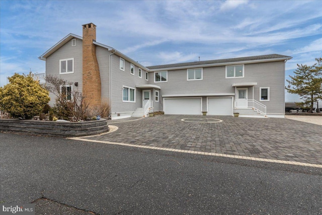 view of front of home with a garage