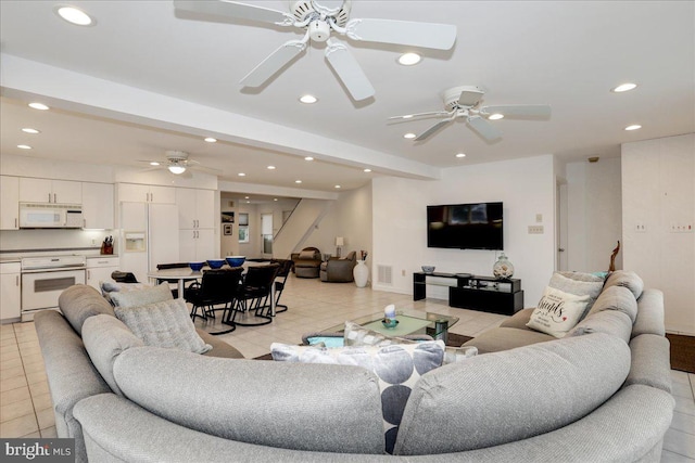 living room with light tile patterned floors and ceiling fan