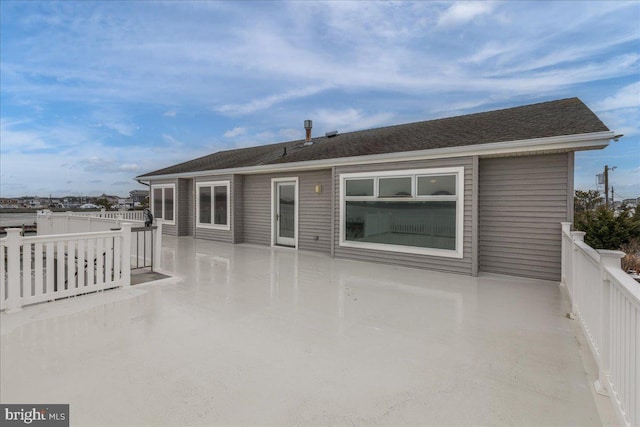 rear view of property featuring a patio area