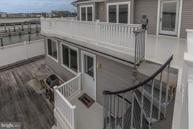 wooden deck featuring a water view