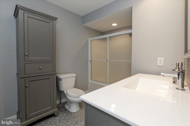 full bathroom with vanity, shower / bath combination with glass door, and toilet