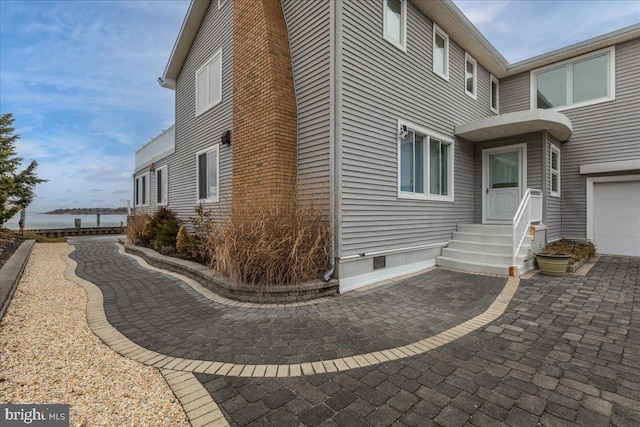 view of property exterior with a garage