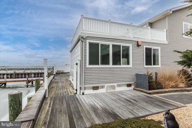 exterior space with a balcony and a deck