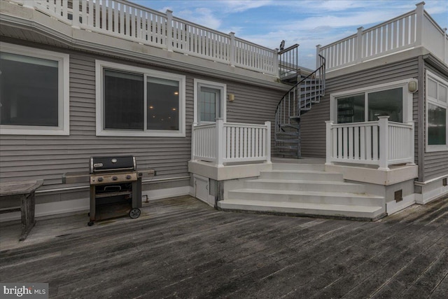 wooden terrace with a grill