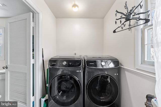 laundry area featuring laundry area and washing machine and clothes dryer