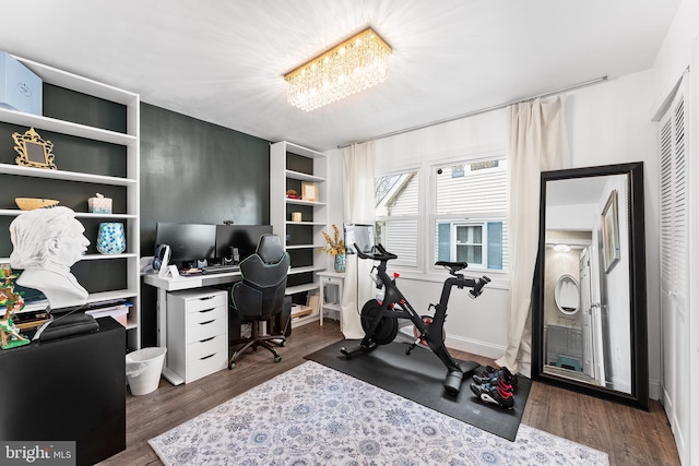 office area with dark wood-style floors and baseboards