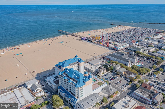 aerial view featuring a view of the beach and a water view