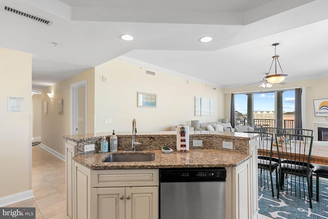 kitchen featuring dishwasher, sink, hanging light fixtures, a kitchen island with sink, and crown molding