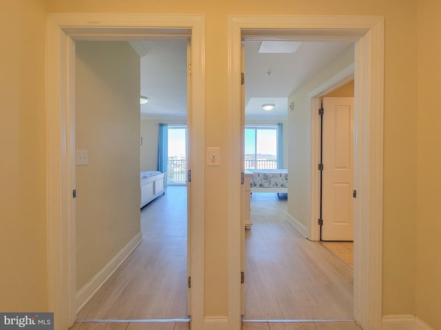 hall with light hardwood / wood-style floors