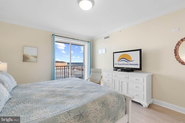 bedroom with ornamental molding, access to outside, and light hardwood / wood-style flooring