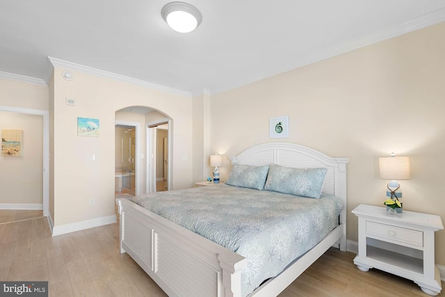 bedroom with ornamental molding and light hardwood / wood-style floors