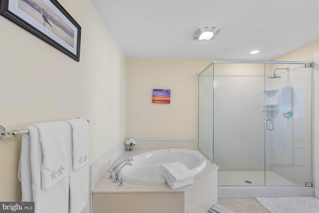 bathroom with plus walk in shower and tile patterned floors