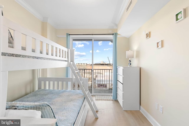 bedroom with crown molding, access to outside, and light hardwood / wood-style floors