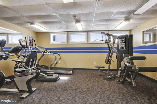 workout area featuring a paneled ceiling