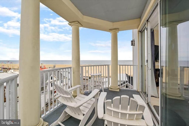 balcony featuring a water view