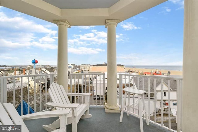 balcony featuring a water view